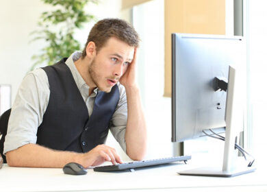 man looking at computer