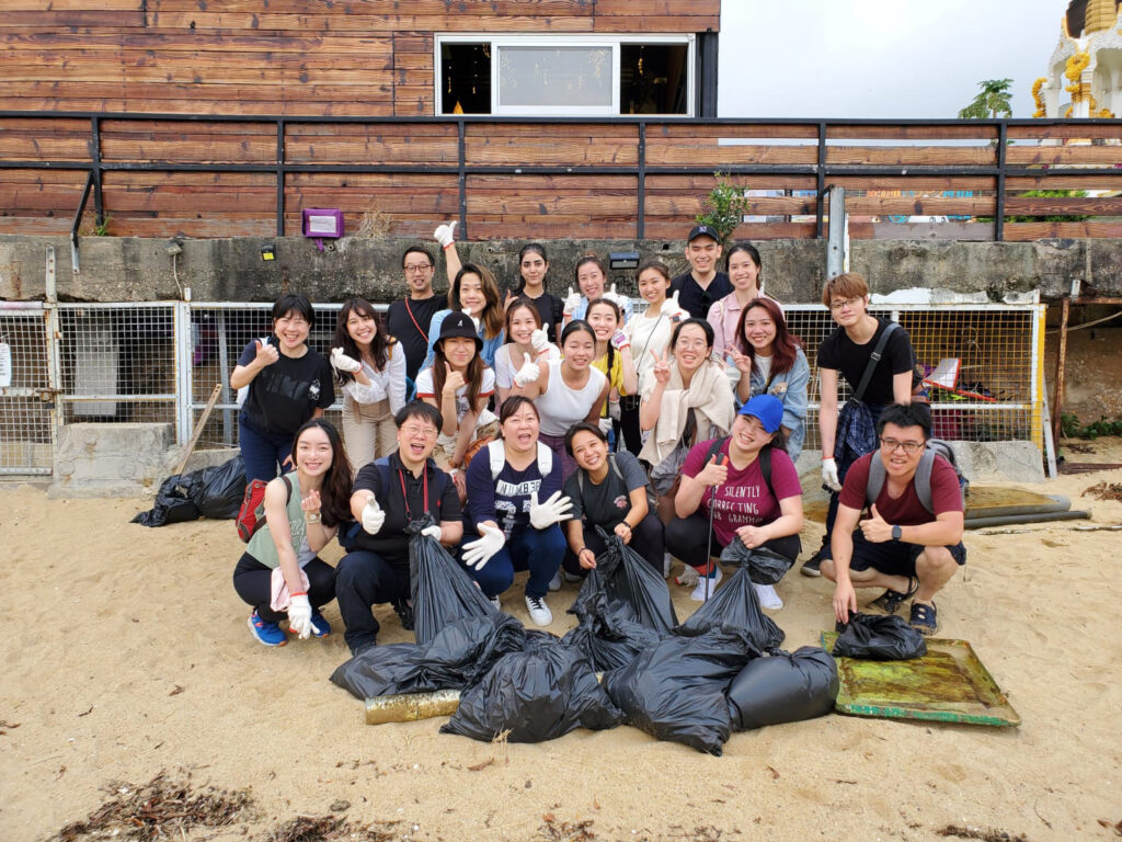 The Hoffman Hong Kong team at their quarterly team building outing doing a beach clean up.