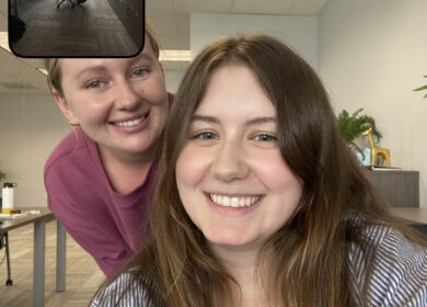 Two young professionals sitting in an office.