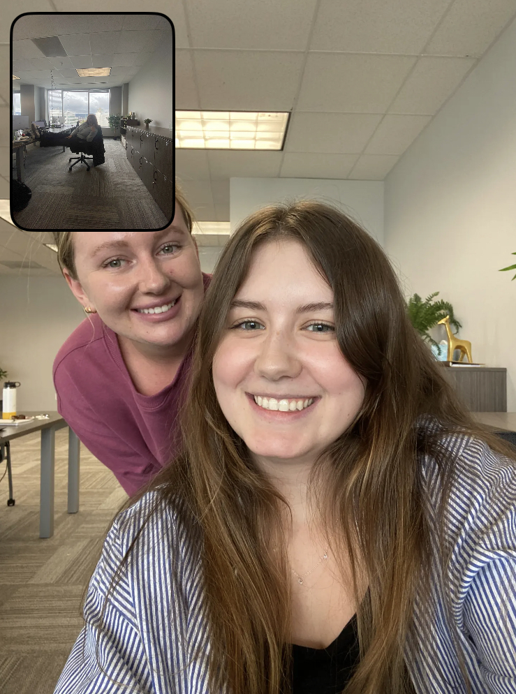 Two young professionals sitting in an office.